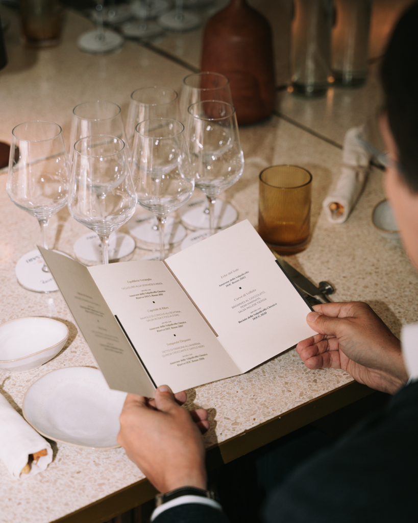 Amarone della Valpolicella Riserva Bosan event dinner gourmet menu person reading