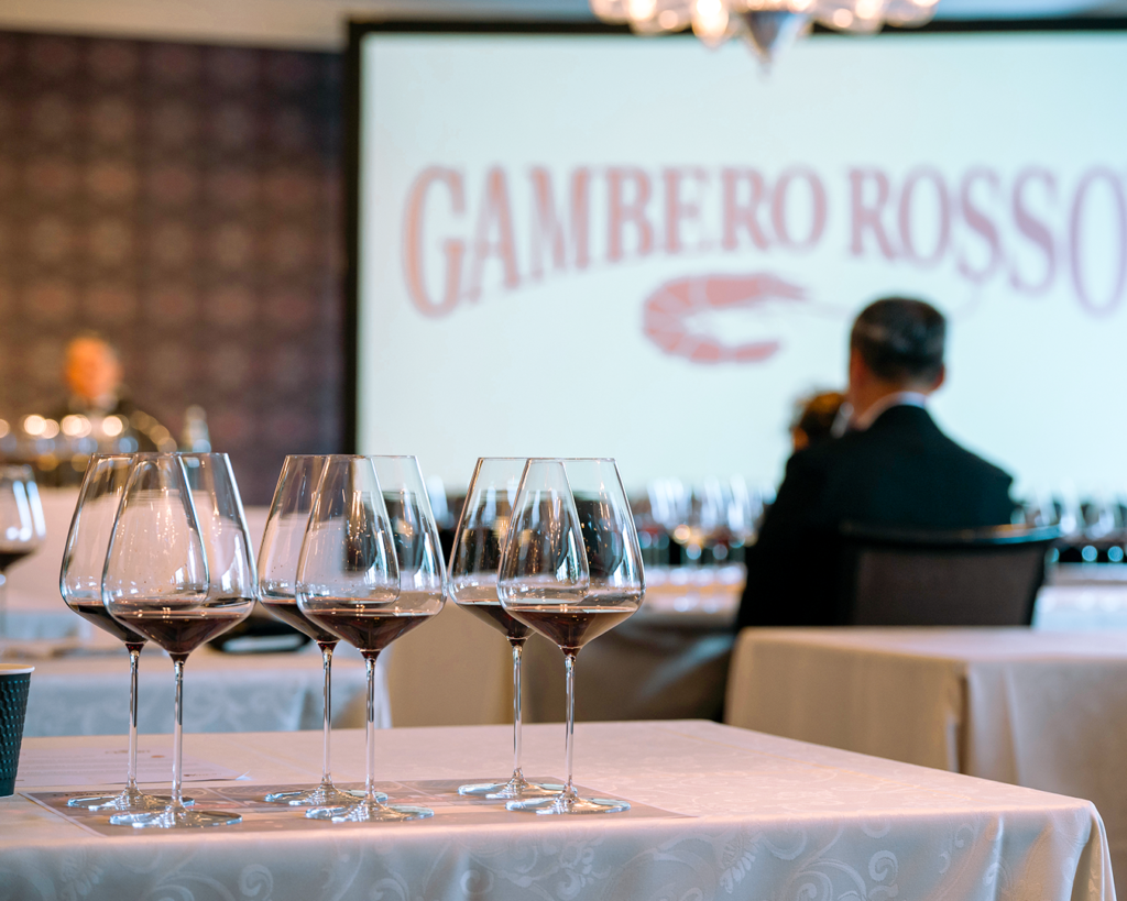 Glasses filled with red wine Bosan Amarone della Valpolicella Cesari, with a blurred background